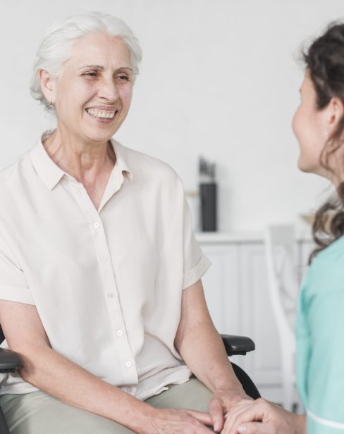 nurse-looking-female-senior-patient-wheel-chair